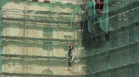 Construction workers on scaffolding Stock Footage 63314771