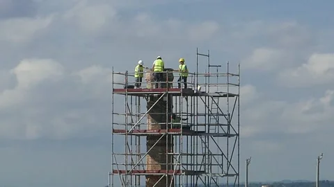 Construction Workers on a Scaffolding Stock Footage 156072558