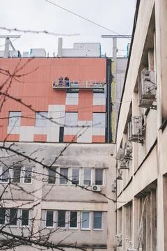 Construction Workers on Scaffolding Stock Photos