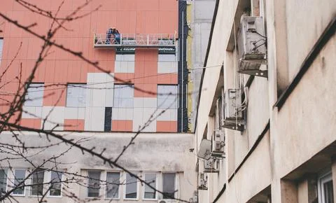 Construction Workers on Scaffolding Stock Photos