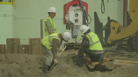 Construction Workers Securing Metal Beam On Construction Site Stock Footage 46589653