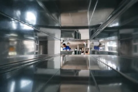 Construction Workers Seen through an Aircon Duct Stock-Fotos