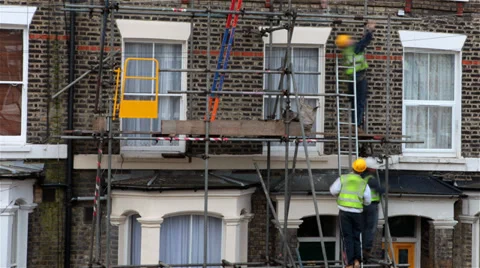 Construction workers setting up scaffold Stock Footage 36038924