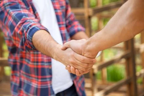 Construction Workers Shaking Hands At Site Stock Photos