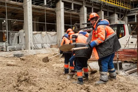 Construction workers with a shovel Stock Photos