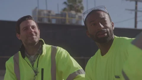 Construction Workers Sit Chatting Outside On Sunny Day Stock Footage 270389786