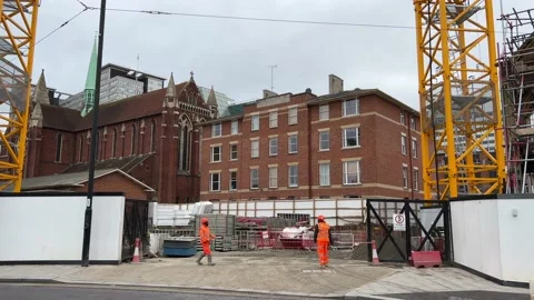 Construction workers at a site access gate, West Croydon, 4K Stock Footage 171409162