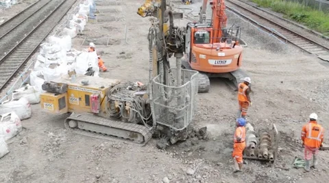 Construction workers on site next to a section of railway track. Stock Footage 68160111