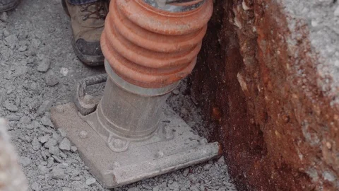 Construction Workers Spread Gravel Out Inside A Trench 스톡 동영상 87482579