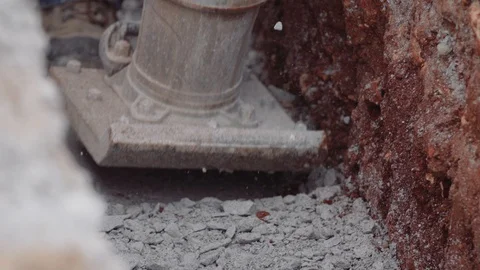 Construction Workers Spread Gravel Out Inside A Trench 스톡 동영상 87482785
