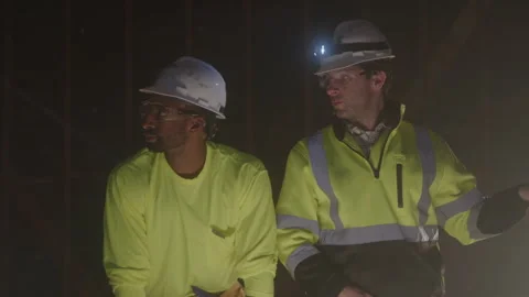 Construction Workers Stand Talking At Night Stock Footage 270390820