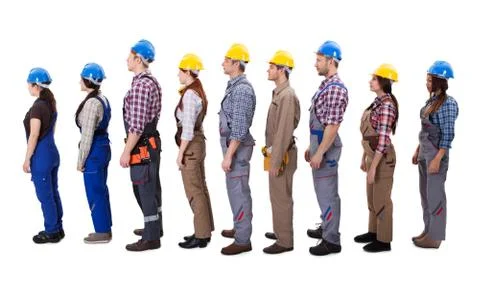 Construction workers standing in queue Foto stock