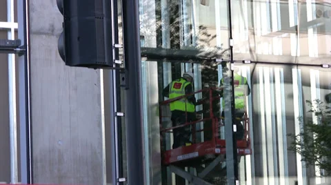 Construction workers standing on a raised platform Stock Footage 37188854