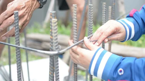 Construction workers steel tie Stock Footage 137817069