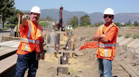 Construction workers surveying construction site Stock Footage 11812063