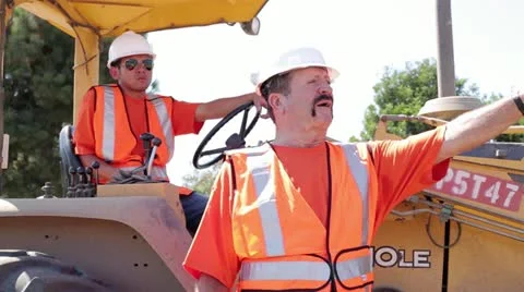 Construction workers surveying construction site on heavy machinery Stock Footage 11812349