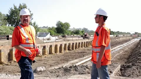 Construction workers surveying irrigation ditch Stock Footage 11811601