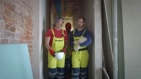 Construction workers talking on construction site Stock Footage 133635113