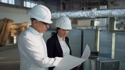 Construction workers, teamwork 4 k Business team discuss a architectural design Stock Footage
