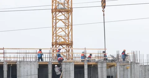 Construction workers on the top level of building site Stock-Footage 146033444