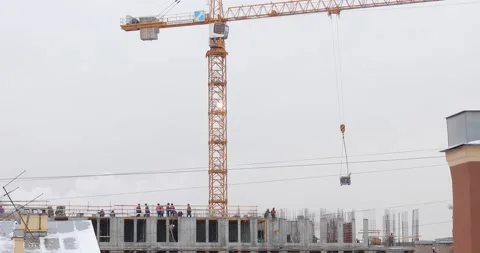 Construction workers on the top level of building site Stock-Footage 146033597