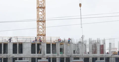 Construction workers on the top level of building site Stock-Footage 146033667