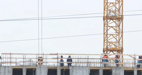 Construction workers on the top level of building site Stock-Footage 146033678