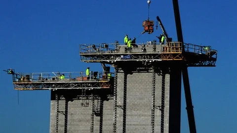 Construction workers on top of tower Stock Footage 73777209