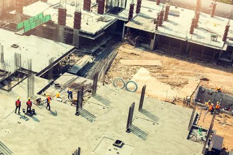Construction workers undergoing construction smoothed the cement floor at the Stock Photos