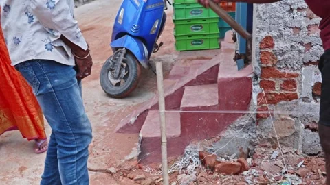 Construction workers using bamboo stakes and string line to align and mark the Stock Footage 312878532