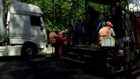 Construction Workers Using Heavy Machinery During Road Construction Stock Footage 142001516