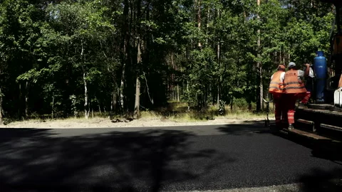 Construction Workers Using Heavy Machinery During Road Construction Stock Footage 142002315