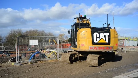 Construction workers using mechanical diggers building new houses selby uk Stock Footage 85929048