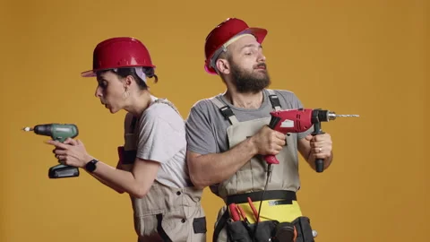 Construction workers using power drill gun to work on industrial renovation Stock Footage 217575929