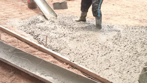 Construction workers using power trowel machine to smooth and finish wet concret Stock Footage 336673727