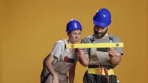 Construction workers using water level tools to measure flat surface Stock Footage 217581895