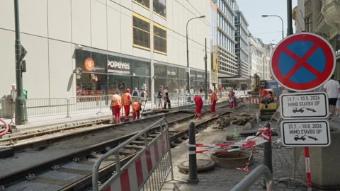 Construction Workers In Vests Repair Tram Tracks On Urban Street In Prague Video stock 342279761
