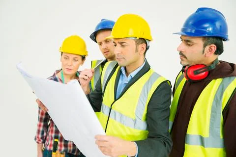 Construction workers viewing blueprints Stock Photos