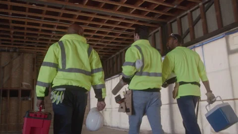 Construction Workers Walk Together In Unfinished Building Stock Footage 270389619