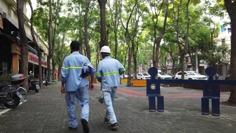 Construction workers walking home after long day, with vegetables and tea, China Stock Footage 160304800