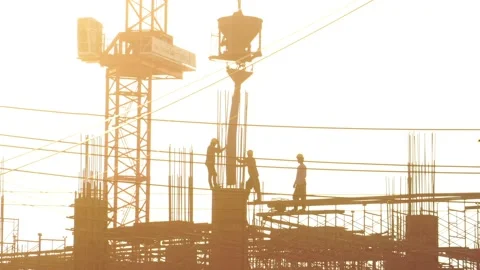 Construction workers watch a crane moving concrete container Stock-Footage 142591313
