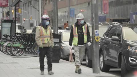 CONSTRUCTION WORKERS WEARING FACE MASKS- COVID19 Stock Footage 130254116