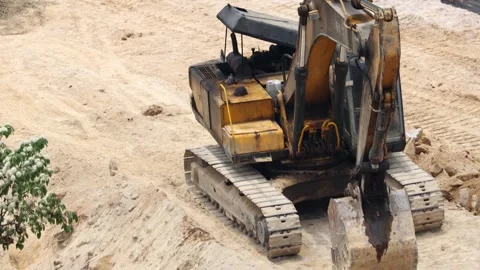 A construction workers wearing safety vests and helmets working outdoors Stock Footage 317356867
