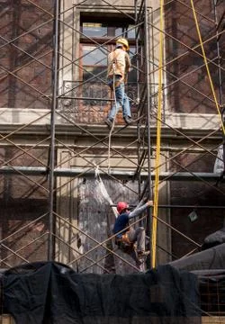 Construction workers wearing safty equipment in construction site Фото