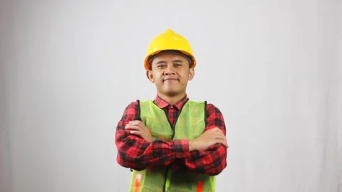Construction workers wearing vests and hard hats cross their arms Stock Footage 319923697