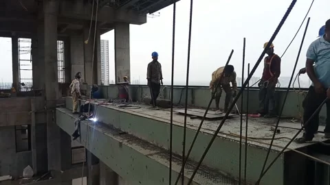 Construction Workers Welding at High-Rise Building Site in Kolkata Stock Footage 337227479