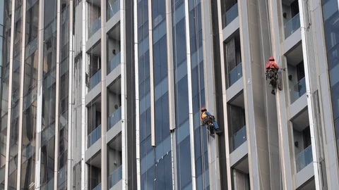 Construction workers work on building a high risk. Stock Footage 115353962