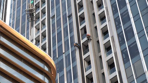 Construction workers work on building a high risk. Stock Footage 115354070