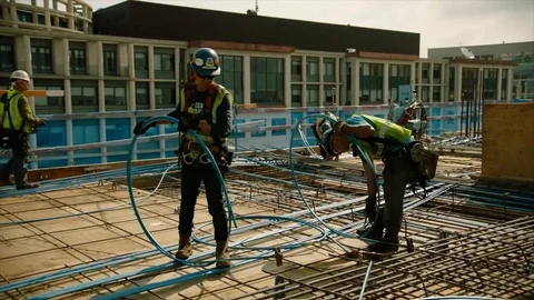 Construction workers work with concrete reinforcement materials - 2017 Stock Footage