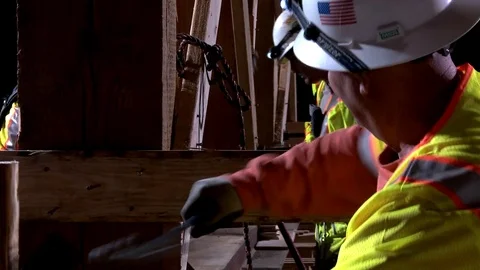 Construction workers work on a freeway overpass at night in Los Angeles. Stockbeeldmateriaal 75698065